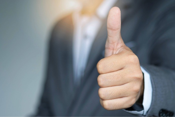 Businessman showing OK approve or like signal Businessman showing OK approve or like signal